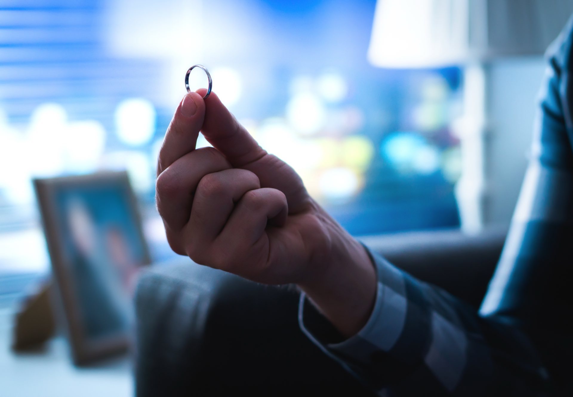 Zoomed in picture of a hand holding a ring